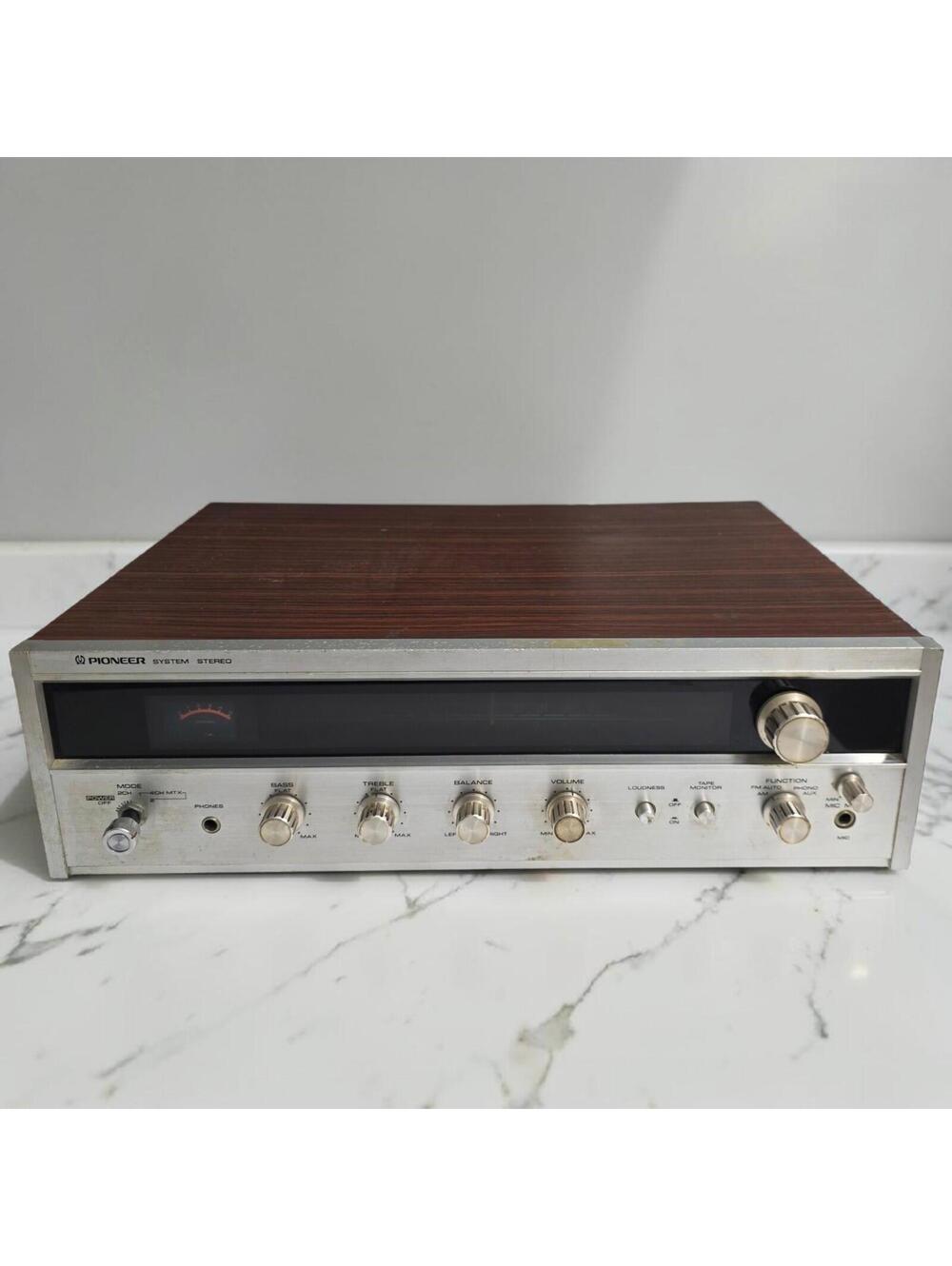 Vintage Pioneer ES-2000 KC stereo receiver in classic woodgrain finish